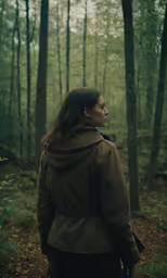 a woman stands in the middle of a forest and looks off into the distance