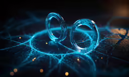 two blue rings sitting on top of a table