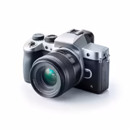 a silver and black camera sitting next to it