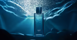 an underwater bottle in front of a light emitting from behind it