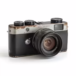 an old looking camera sitting on top of a table