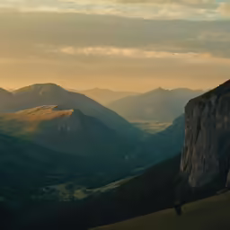 the view of a green mountain valley