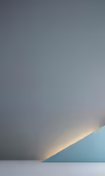 the back side of a triangular building in a foggy room