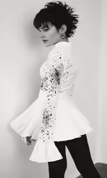a woman is posing for a black and white photo