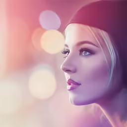 a woman with a beanie looks off into the distance