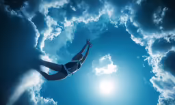 the woman is swimming beneath the bright sun