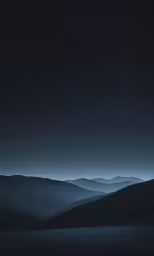 a mountain valley filled with lots of hills