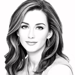 a woman with dark hair wearing a top