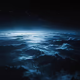 a picture of the night sky over some water