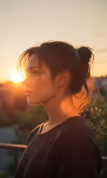 a woman with a ponytail stands in the sun
