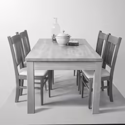a white and black picture of a dining table with chairs