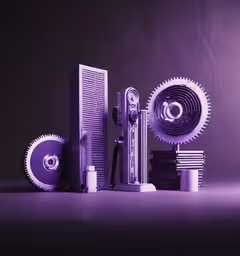 an assortment of modern art work and a disc shaped piece,various items displayed in front of an empty wall