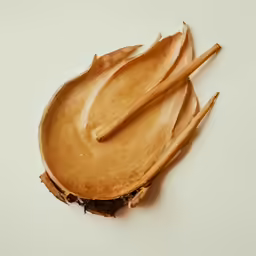 an image of three wooden utensils that look like an apple