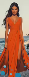the woman is wearing an orange dress with a big slit