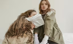 two women with a towel on their face