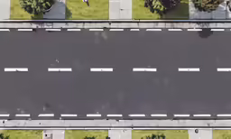 a view from above shows the roadway on an empty street