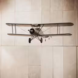 an old fashioned airplane is flying in the air