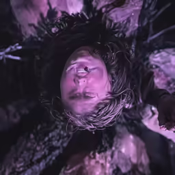 the man is submerged upside down with his head above water