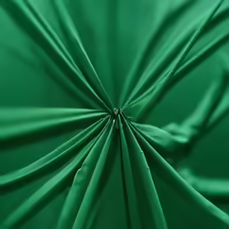 this is the center of a close up view of a green paper umbrella