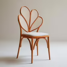 the chair with a white cushion is in the shape of a flower