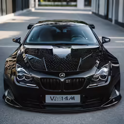 black car parked on a street with the hood in the air