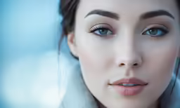closeup of a woman with blue eyes and fur stole around her neck