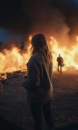 two people in front of a fire
