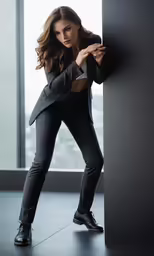 a woman leaning on the side of a pillar