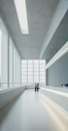 two people in an empty building sitting on some stairs