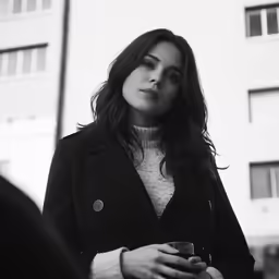 black and white photograph of a woman outside