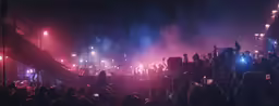 crowd of people with lights and stage lighting