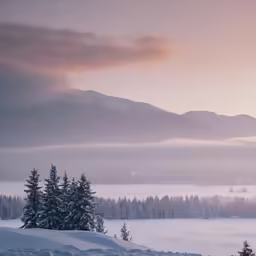 a very nice mountain covered in clouds and snow