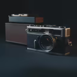 a black and brown camera with an analog camera on the front