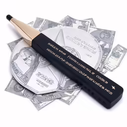 an item on top of money on a table