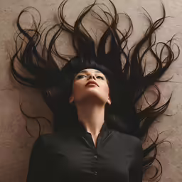 woman with long, black hair on top of her head