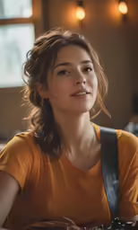 a woman that is sitting down with some kind of bag