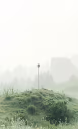 two animals are standing in a field near a windmill