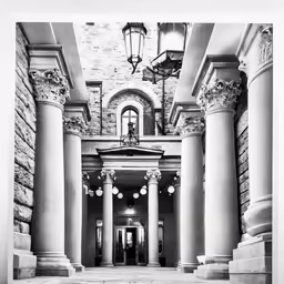 a building with columns and a clock in the center