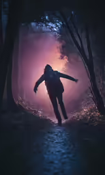 the person in the hoodie is running through the dark woods