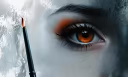 the eye of a person with orange eyeshadow with powdered eyebrows