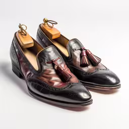 the shoes are made of black leather with metallic paint,there are two different color tassels on this pair of shoes