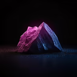 a large rock with some pink and purple lights on