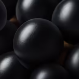 an array of black spheres on a table