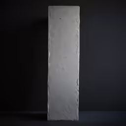 an art piece made from concrete in a dark room