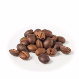 nuts are spilled into a pile on a white plate