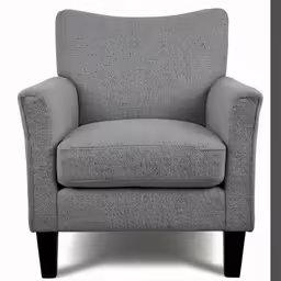 an upholstered chair against a white background