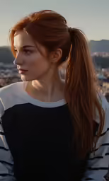 a red haired woman with long hair in profile