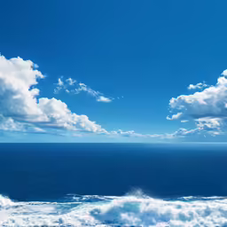 there is a large ocean with white clouds in the sky