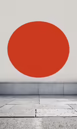 a large red circle that is sitting on the side of the road