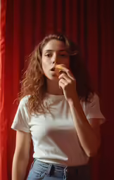 a woman wearing a white shirt and jeans